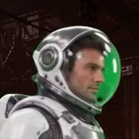 Close-up of the helmet: the visor glass still carries green from the studio