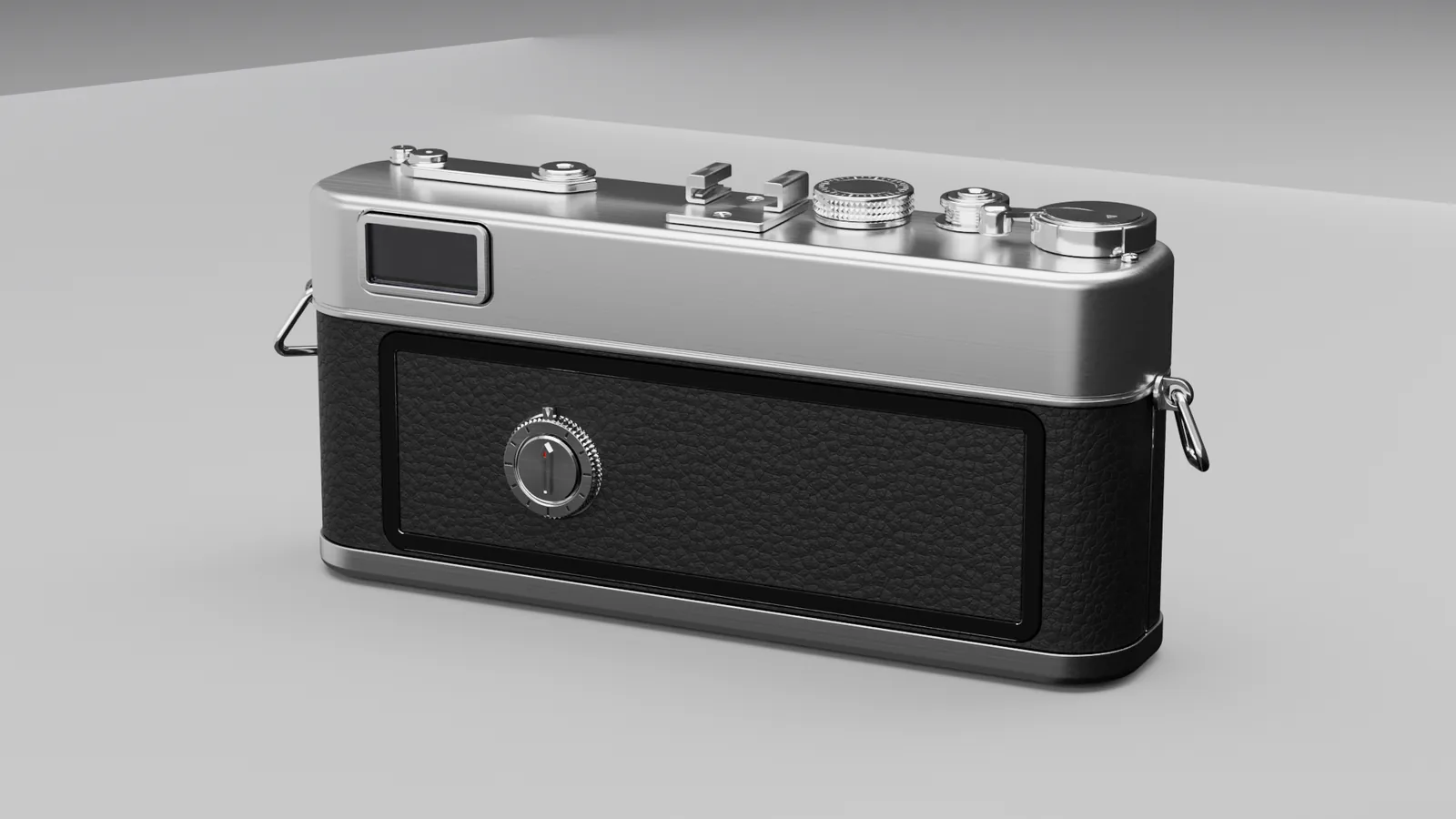 Back three-quarter: eyepiece, hinged door, film reminder dial